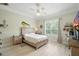 Nautical-themed bedroom with wood flooring, a window, and nautical décor at 19 Tomoka Cove Way, Ormond Beach, FL 32174