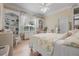 Well-lit bedroom featuring hardwood floors, built-in shelving, and an accent window provides a relaxing and functional living space at 19 Tomoka Cove Way, Ormond Beach, FL 32174