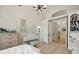 Bright bedroom with a piano, light hardwood floors, and high ceilings offers a serene space at 19 Tomoka Cove Way, Ormond Beach, FL 32174