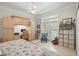 Nautical themed bedroom with desk, shelving, and french doors to the pool at 19 Tomoka Cove Way, Ormond Beach, FL 32174