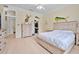 Bedroom featuring hardwood floors, nautical decorations, and ensuite bathroom providing a relaxing and well-appointed living space at 19 Tomoka Cove Way, Ormond Beach, FL 32174