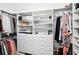 Spacious closet with built-in shelving and drawers for organized storage of clothes and accessories at 19 Tomoka Cove Way, Ormond Beach, FL 32174