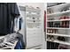 Well-organized walk-in closet featuring shelving and drawers for clothing and accessories at 19 Tomoka Cove Way, Ormond Beach, FL 32174