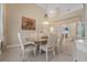Neutral dining room featuring a chandelier, tasteful artwork, and a view to another living area at 19 Tomoka Cove Way, Ormond Beach, FL 32174