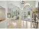 Grand foyer with soaring ceilings, marble floors, and a view of the formal living area at 19 Tomoka Cove Way, Ormond Beach, FL 32174
