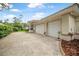 Spacious three-car garage showcasing ample parking and storage with an extended driveway at 19 Tomoka Cove Way, Ormond Beach, FL 32174