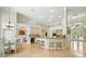 Open-concept kitchen and dining area with modern appliances and a breakfast bar at 19 Tomoka Cove Way, Ormond Beach, FL 32174