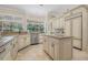 Well-equipped kitchen featuring granite countertops, a center island, and ample cabinet space at 19 Tomoka Cove Way, Ormond Beach, FL 32174