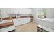 Bright laundry room with lots of cabinets, counter space, and utility sink at 19 Tomoka Cove Way, Ormond Beach, FL 32174