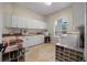 Bright laundry room with plenty of storage, shelving, and a view of the outdoors at 19 Tomoka Cove Way, Ormond Beach, FL 32174