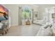 Bright and airy living room with large windows, hardwood floors, and comfortable seating at 19 Tomoka Cove Way, Ormond Beach, FL 32174