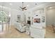Bright open living space with large windows, comfortable seating, and an entertainment center at 19 Tomoka Cove Way, Ormond Beach, FL 32174