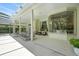 Covered outdoor seating area features comfortable seating and clear view through bay window at 19 Tomoka Cove Way, Ormond Beach, FL 32174