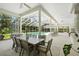 Screened-in pool area with a large swimming pool, patio seating, and lush landscaping at 19 Tomoka Cove Way, Ormond Beach, FL 32174