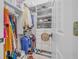 Walk-in closet with shelving and hanging rods provides ample storage space for clothing, accessories and personal items at 19 Tomoka Cove Way, Ormond Beach, FL 32174