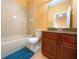 Bright bathroom featuring a shower/tub combo and wood vanity at 19320 Oberly Pkwy, Orlando, FL 32833