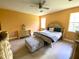 Serene bedroom featuring a stylish bed, hardwood floors, and plenty of natural light for a peaceful ambiance at 19320 Oberly Pkwy, Orlando, FL 32833