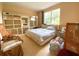 Bedroom featuring large window and multiple shelving units at 19320 Oberly Pkwy, Orlando, FL 32833