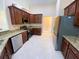 Beautiful kitchen with granite counters, stainless steel appliances, and rich cabinetry, perfect for culinary enthusiasts at 19320 Oberly Pkwy, Orlando, FL 32833