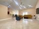 Bright living room boasts tile floors, ample seating, and an open layout, perfect for entertaining guests at 19320 Oberly Pkwy, Orlando, FL 32833