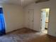 A bedroom with a ceiling fan and an ensuite bathroom and closet at 1973 S Old Mill Dr, Deltona, FL 32725