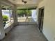 Empty Screened Porch, large space is ideal for relaxing and is directly outside the dining area at 1973 S Old Mill Dr, Deltona, FL 32725