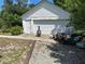 Utility Garage/Shed in backyard next to gravel area, with garage door and storage, good for a workshop at 1973 S Old Mill Dr, Deltona, FL 32725