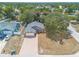 Aerial view of a single-Gathering home featuring a brick driveway, manicured front lawn, and attached garage at 198 Heather Lane Dr, Deltona, FL 32738
