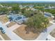 Aerial view of a single-Gathering home featuring a brick driveway, manicured front lawn, and attached garage at 198 Heather Lane Dr, Deltona, FL 32738