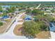 Aerial view of a single-Gathering home featuring a brick driveway, manicured front lawn, and attached garage at 198 Heather Lane Dr, Deltona, FL 32738
