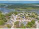 Beautiful aerial view featuring homes near a lake, surrounded by lush greenery and a serene atmosphere at 198 Heather Lane Dr, Deltona, FL 32738