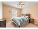 Bedroom with carpet, wooden headboard, fan and window with blinds for natural light at 198 Heather Lane Dr, Deltona, FL 32738