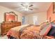 Cozy bedroom with large dresser, mirror and view to entry at 198 Heather Lane Dr, Deltona, FL 32738