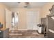 A well lit room with dark hardwood floors, ceiling fan and closet space at 198 Heather Lane Dr, Deltona, FL 32738