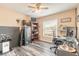 A well lit room with dark hardwood floors with a ceiling fan and plenty of space at 198 Heather Lane Dr, Deltona, FL 32738