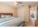 Bedroom with carpet, wooden headboard, fan and large closet at 198 Heather Lane Dr, Deltona, FL 32738