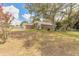 Charming single-story home with a brick driveway and well-maintained lawn and mature trees at 198 Heather Lane Dr, Deltona, FL 32738