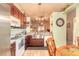 Cozy kitchen with wood cabinets, stainless appliances and a charming decorative flair at 198 Heather Lane Dr, Deltona, FL 32738