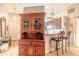 Lovely kitchenette with wood cabinets, stainless steel appliances and bar stool seating at 198 Heather Lane Dr, Deltona, FL 32738