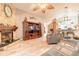 Comfortable living room with brick fireplace and mantle and decorative ceiling fan at 198 Heather Lane Dr, Deltona, FL 32738