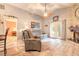 Living room with brick fireplace, modern light fixtures, and view to bedroom at 198 Heather Lane Dr, Deltona, FL 32738