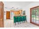Eat-in kitchen featuring wood cabinets, bar stool seating and a door that leads to the outdoors at 2 E Kelly Park Rd, Apopka, FL 32712