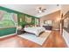 Spacious main bedroom with hard wood floors, a ceiling fan, and plenty of natural light at 2 E Kelly Park Rd, Apopka, FL 32712