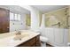 Bathroom featuring walk-in tub, accessible grab bars, and marble sink at 2080 Roseway Ave, Deltona, FL 32738