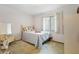 Bedroom with neutral walls, carpet and a charming bed at 2080 Roseway Ave, Deltona, FL 32738