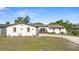 Charming single-story home showcasing a circular driveway and unique, decorative architectural details at 2080 Roseway Ave, Deltona, FL 32738