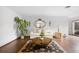 Spacious living room with hardwood flooring, stylish decor, and ample natural light at 2080 Roseway Ave, Deltona, FL 32738