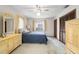 Light-filled bedroom with ceiling fan, closet, and charming décor, creating a serene and inviting atmosphere at 2080 Roseway Ave, Deltona, FL 32738