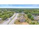 Aerial shot of the house surrounded by green spaces, showing the neighborhood and local road network at 2234 N Normandy Blvd, Deltona, FL 32725