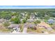 Aerial view highlighting the home's setting in a tranquil, tree-lined community with convenient access to amenities at 2234 N Normandy Blvd, Deltona, FL 32725